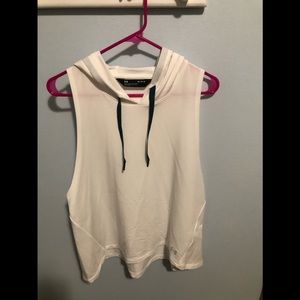 Youth loose fit Under Armour top with good. White color sleeveless. Size medium.